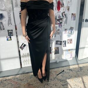 Selling a CUSTOM made black gown. Fits a size 6/8. NEVER worn. Paid $2500